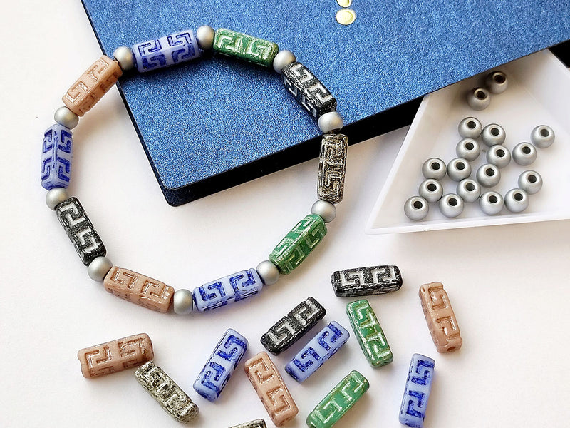 Creative Set: DIY Bracelet made of multi-color Celtic Block and Pony Beads with silver accents.