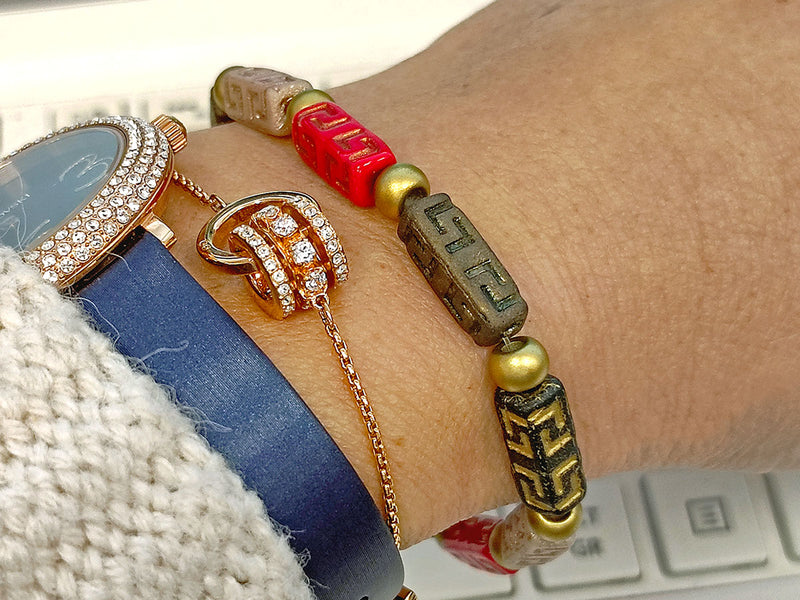 Creative Set: DIY Bracelet made of multi-color Celtic Block and Pony Beads with gold accents.
